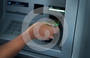 Woman using banking machine