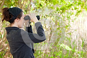 Woman using binoculars