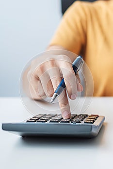 Woman using calculator. Contract agreement, rental finance and accounting concepts