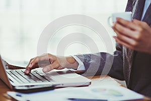 Woman using calculator on her desk