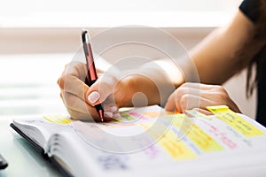 Woman Using Calendar Notebook Diary For Agenda