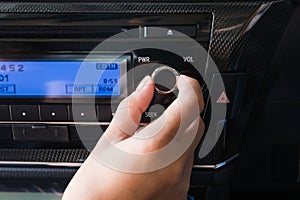 Woman using car volume audio