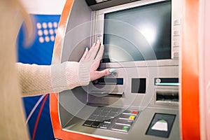 Woman using atm cash machine