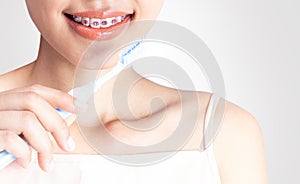 A woman is using a cleaning teeth