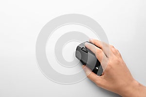Woman using computer mouse on white background, top view