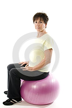Woman using core training fitness ball exercising