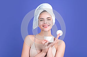 Woman using cotton pad. Beautiful girl cleaning skin by cotton pad. Facial toner or cleansing milk. Removing makeup