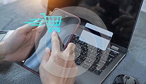 Woman using credit card filling in billing information in purchase of laptop computer in ecommerce store. Concept: online payment