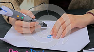 Woman using 3D printing pen
