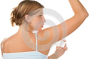 Woman using deodorant photo