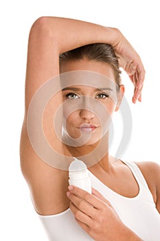 Woman using deodorant