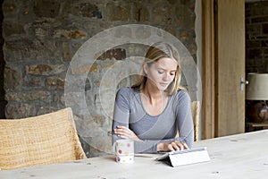 Woman using digital tablet