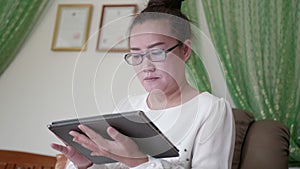 Woman using digital tablet computer.