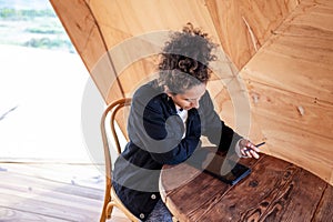 Woman using a digital tablet with an electronic pen.