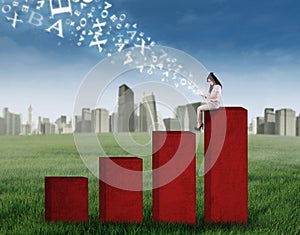 Woman using ditigal tablet on chart photo