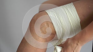 Woman using elastic bandage on varicose veins legs health medicine problem to support