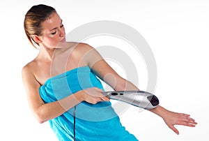 Woman using electric massager