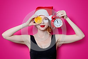 Woman using eye patch for her eyes in Santa Claus hat