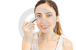 Woman using eyeliner