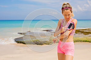 Woman using fitness tracking app on smartphone