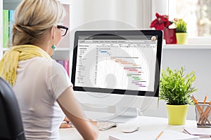 Woman using Gantt chart for project management photo