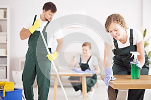 Woman using green cleaning detergent