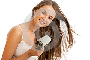 Woman using hairdryer