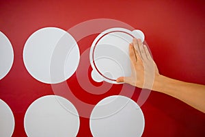 Woman using hands with dot graphic on red wall. Business info gr