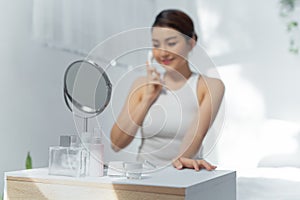 Woman using handy ion introduction instrument. skincare concept