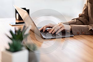 Woman using her personal computer at home office