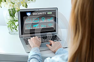 Woman using home security app, closeup