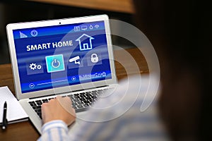 Woman using home security app, closeup