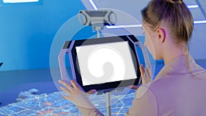 Woman using interactive empty white touchscreen display