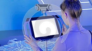 Woman using interactive empty white touchscreen display