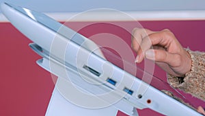 Woman using interactive touchscreen display at urban exhibition