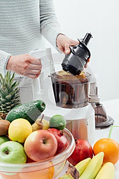 Woman using a juice extractor