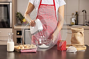 Woman using a kitchen mixer