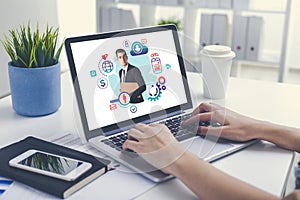 Woman using laptop, cloud computing interface