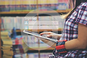 Woman using laptop computer and sign up or log in username password in library room and bookshelf background,GDPR.cyber security