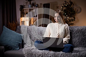 Woman using laptop at home