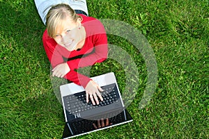 Woman using laptop outdoors