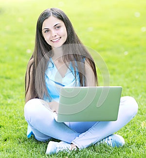 Woman using a laptop outdoors
