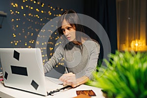 Woman using laptop to make shopping and browsing online store