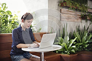 Woman Using Laptop Working Browsing Concept