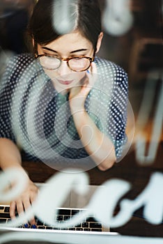 Woman Using Laptop Working Browsing Concept