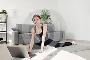 Woman using laptop for workout