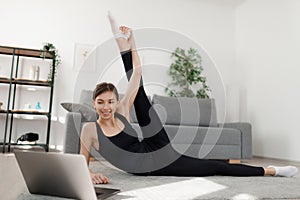 Woman using laptop for workout