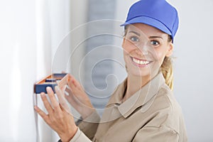 woman using leveling tool at home