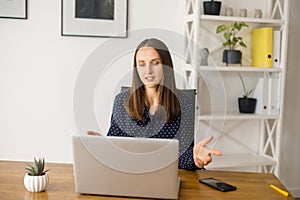 Woman using lptop for video meeting
