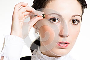 Woman using micro memory card pluging into head